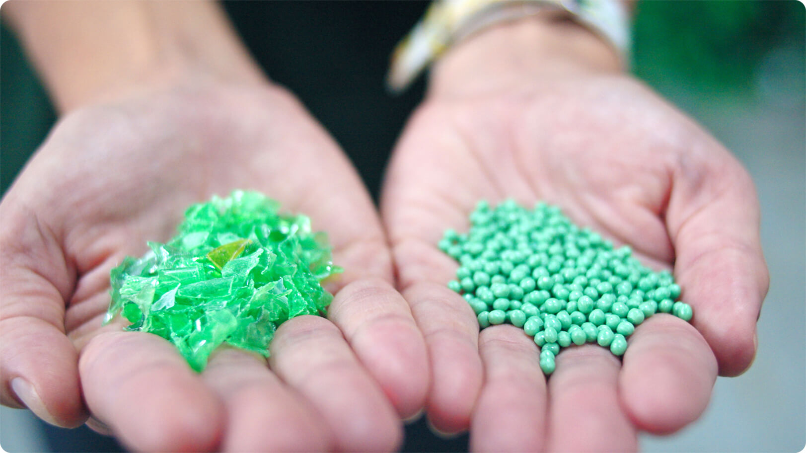 Recycled plastic in 2 forms. Green Pellets and green flakes